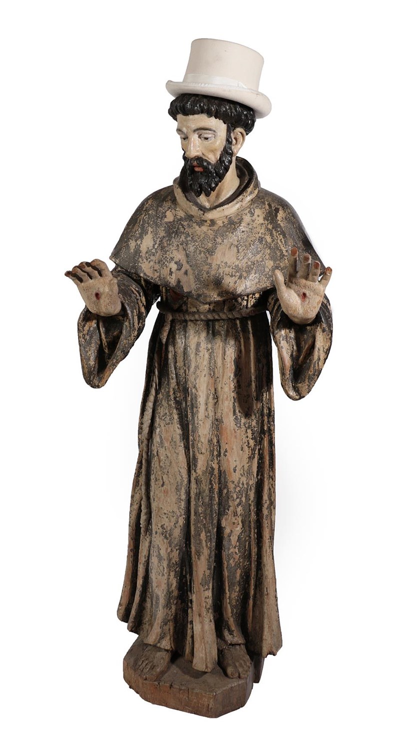 Lot 31 - An Italian Polychrome Wooden Figure of St Francis of Assisi, 18th century, displaying the stigmata