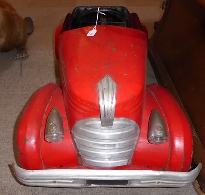 Lot 40 - A 1920's/30's Metal Bodied and Red Painted Child's Pedal Car, with stylised mascot grille and...