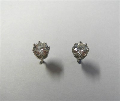 Lot 561 - A Pair of Diamond Solitaire Stud Earrings, the round brilliant cut diamonds in white claw settings