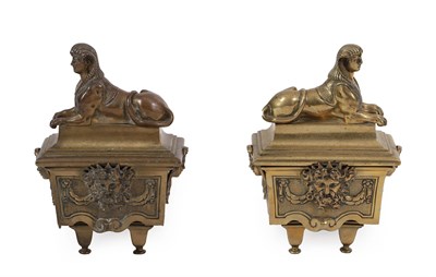 Lot 86 - A Pair of French Brass Chenet, 19th century, modelled as sphinxes on plinth bases adorned with...