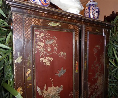 Lot 87 - A Black and Red Chinoiserie Painted Cabinet on Stand, part 18th century, the later moulded...