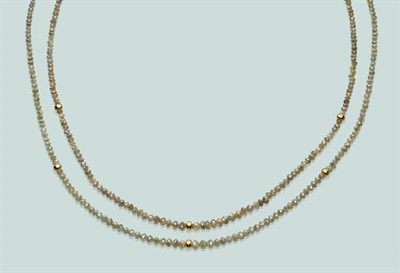 Lot 563 - A Double Row Diamond Necklace, the champagne coloured faceted diamonds with rondels at...