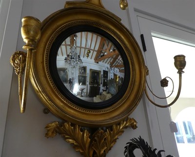 Lot 103 - A William IV Giltwood Convex Girandole Mirror, 2nd quarter 19th century, with ebonised and...