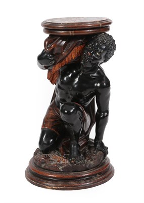 Lot 105 - A Carved Blackamoor Jardiniere Stand, 19th century, modelled as a crouching draped male...