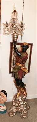 Lot 107 - A Venetian Carved and Painted Wood Torchere, in 18th century style, as a blackamoor holding a...