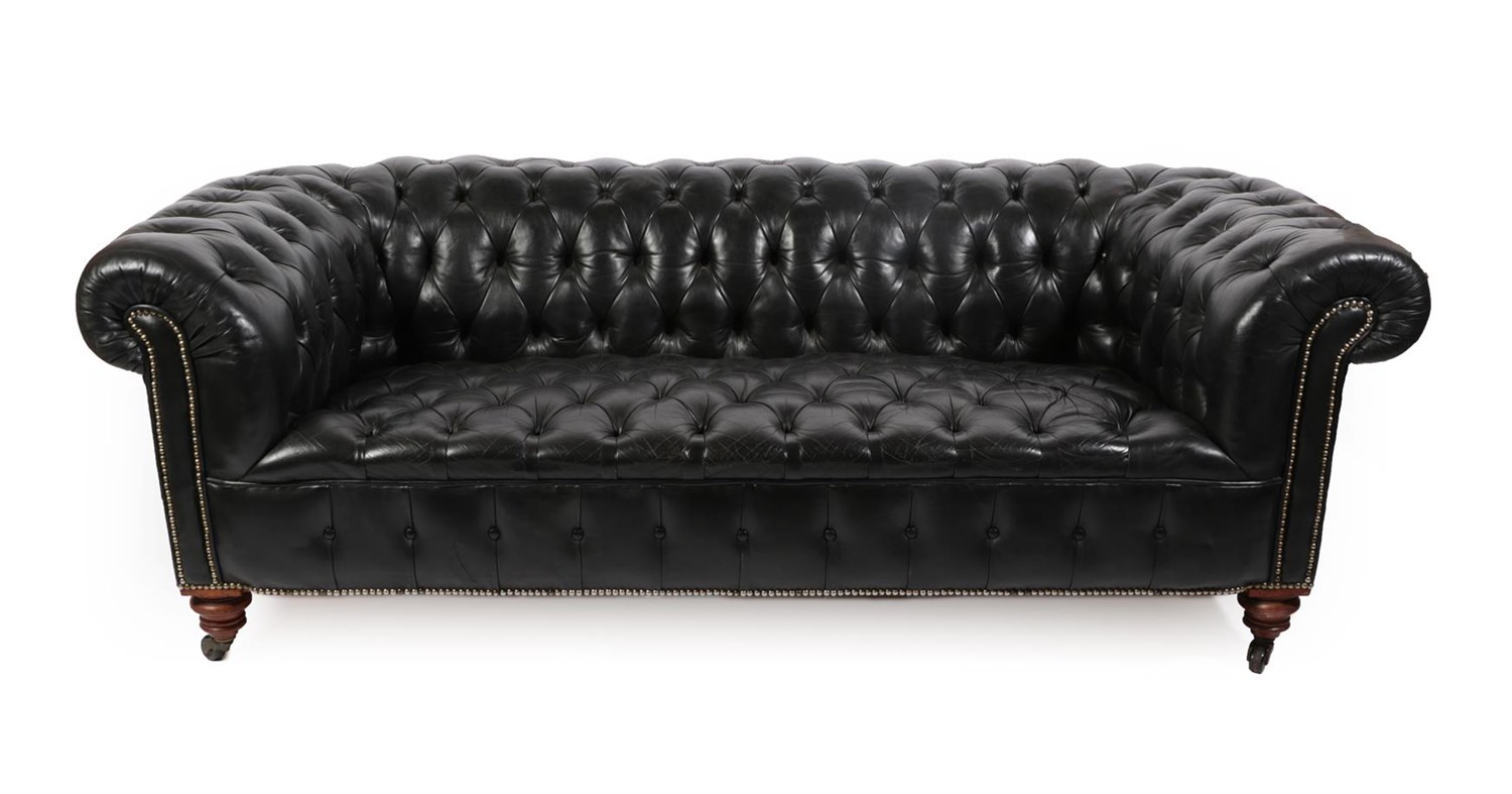 Lot 139 - A Late Victorian Black Leather Chesterfield, late 19th century, the low back and wide scroll...