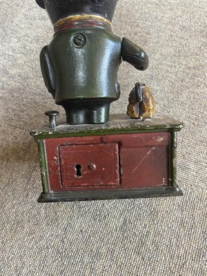 Lot 140 - A Cast Iron Mechanical Money Box ''Stump Speaker'', modelled as a man wearing a top hat, a...