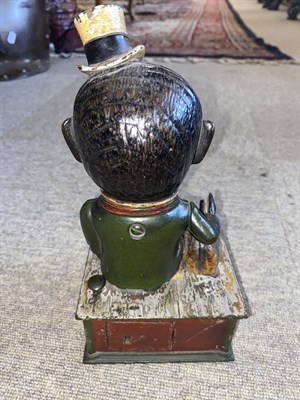 Lot 140 - A Cast Iron Mechanical Money Box ''Stump Speaker'', modelled as a man wearing a top hat, a...