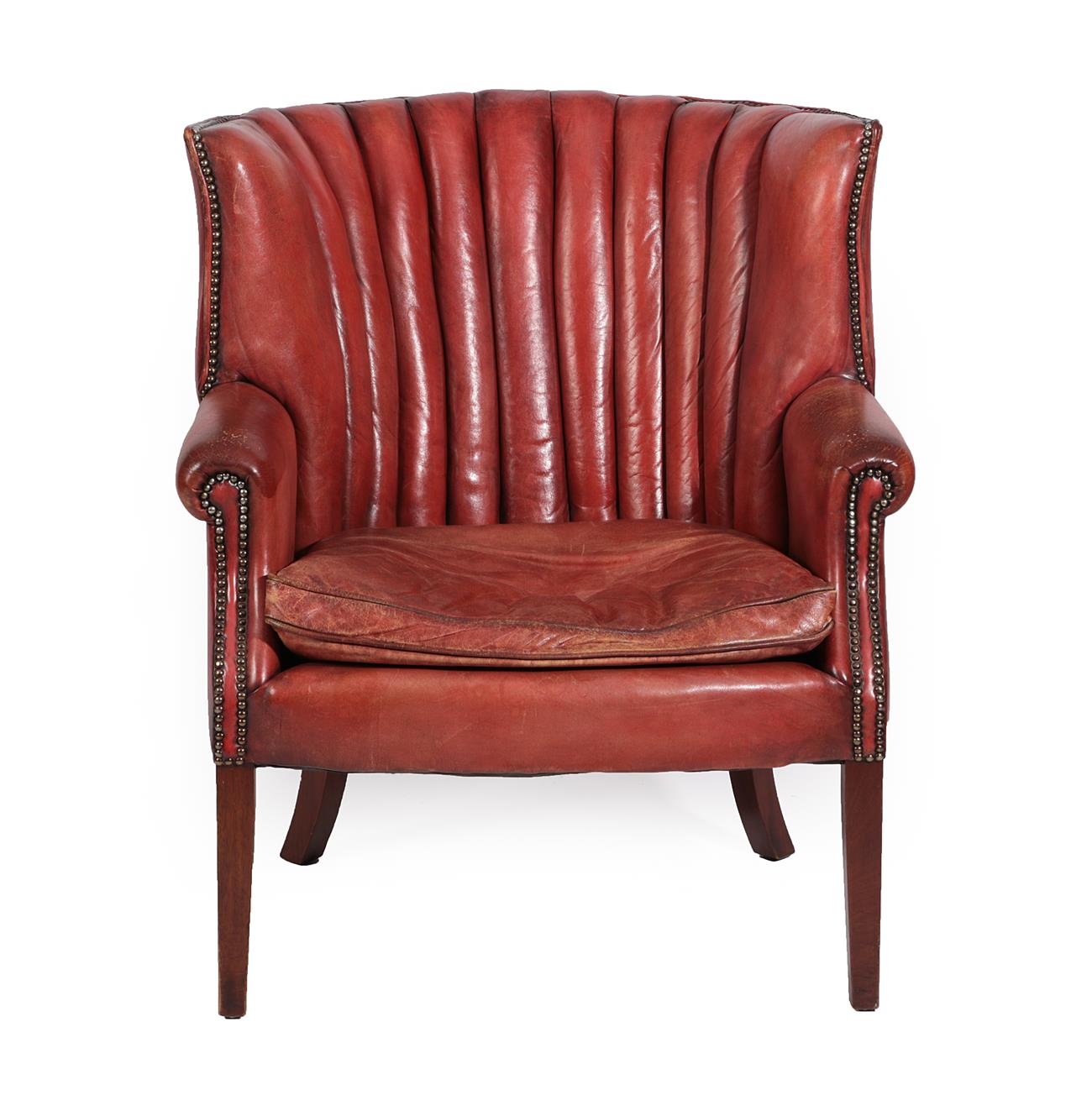 Lot 146 - A 20th Century Barrel Shaped Library Armchair, covered in close-nailed red leather, with...