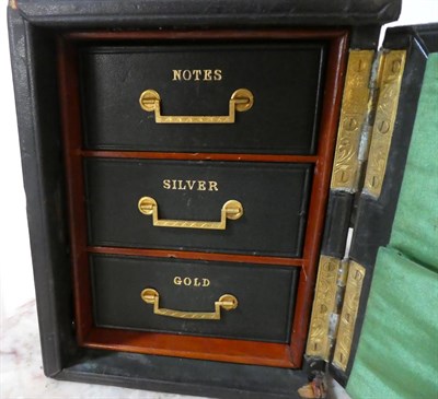 Lot 181 - A Victorian Leather Bound Novelty Gentleman's Desktop Money Safe, by Baxter, Cockspur St...