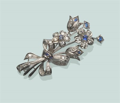 Lot 571 - A Sapphire and Diamond Floral Brooch, round brilliant cut and single-cut stones arranged in a spray