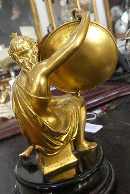 Lot 187 - A Gilt Bronze Watch Stand, 19th century, modelled as a kneeling goddess with star tiara holding...