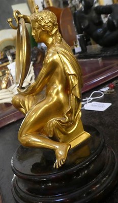 Lot 187 - A Gilt Bronze Watch Stand, 19th century, modelled as a kneeling goddess with star tiara holding...