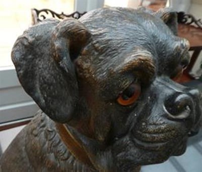 Lot 189 - An Austrian Painted Terracotta Figure of a Pug, circa 1900, seated, with glass eyes and brown...