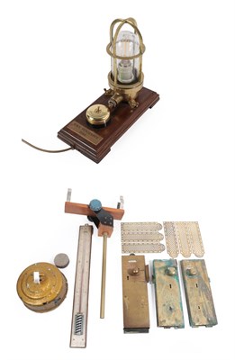 Lot 192 - A Brass Mounted Ship's Light and Switch, on an oak stand inscribed HMS Vengeance 1944, 28cm long; A