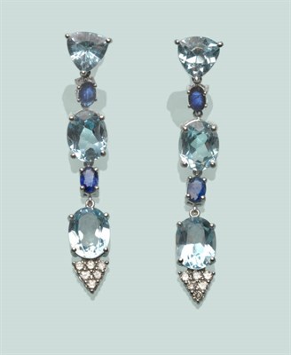 Lot 572 - A Pair of Aquamarine, Sapphire and Diamond Drop Earrings, a triangular shaped aquamarine...