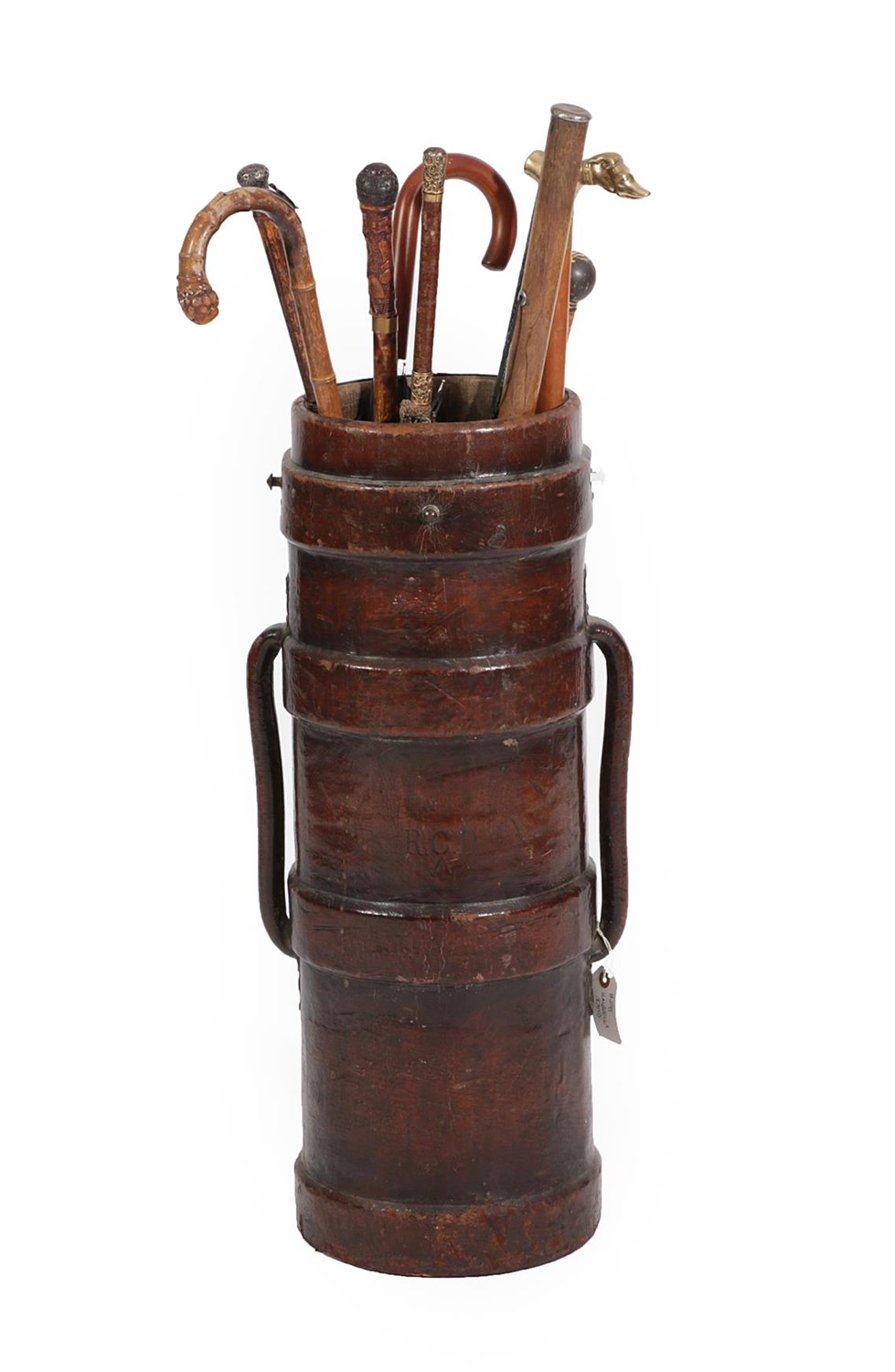 Lot 195 - A Leather Bound Umbrella Stand, in the form of an ammunition carrier, of ribbed cylindrical...