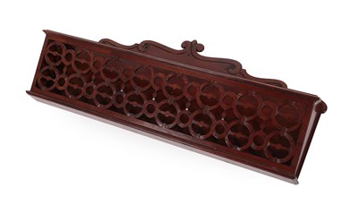 Lot 201 - A Late Regency Mahogany Paper Rack, early 19th century, with scroll carved and shaped backplate and
