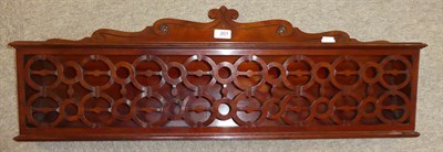Lot 201 - A Late Regency Mahogany Paper Rack, early 19th century, with scroll carved and shaped backplate and