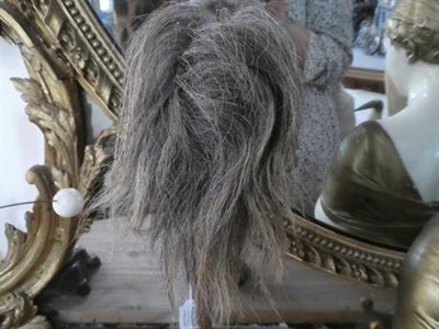 Lot 205 - Two Reproduction Shrunken Heads, applied with hair, each approximately 20cm high; An Ebonised...
