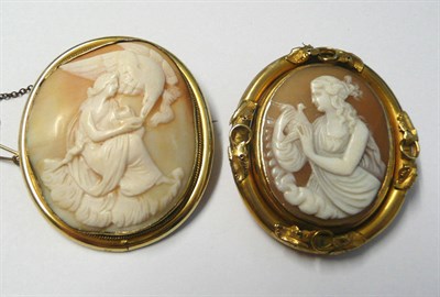 Lot 576 - Two Cameo Brooches, one an oval shell cameo depicting a lady with an eagle, within a plain...