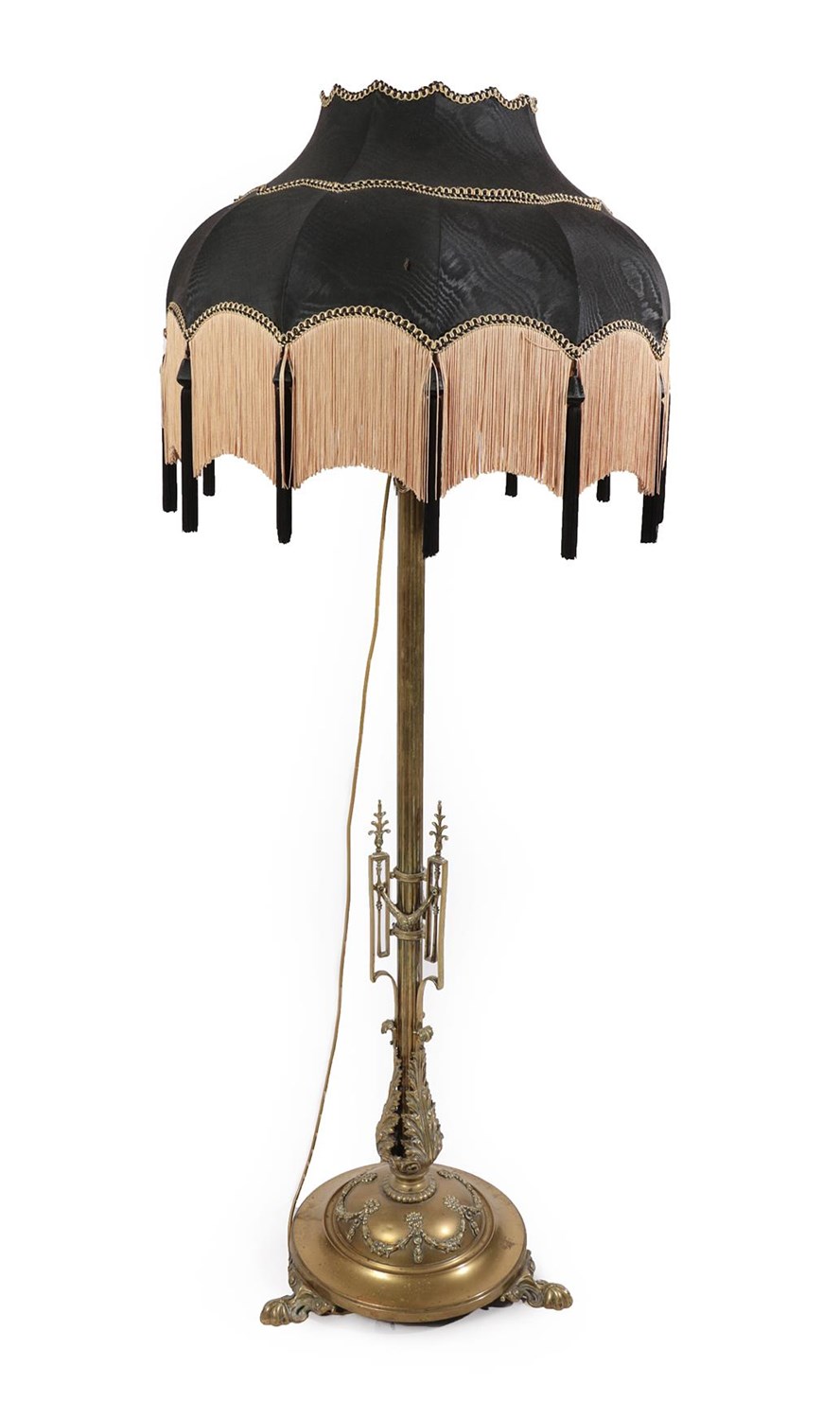 Lot 250 - A Victorian Telescopic Brass Standard Lamp, the reeded stem with applied swag work decoration above