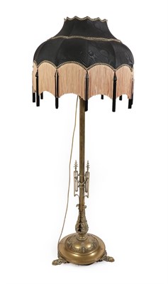 Lot 250 - A Victorian Telescopic Brass Standard Lamp, the reeded stem with applied swag work decoration above