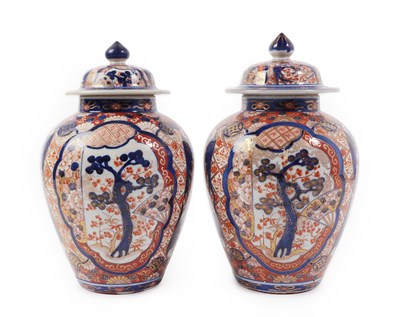 Lot 272 - A Pair of Imari Porcelain Jars and Covers, Meiji period, of baluster form, typically painted...