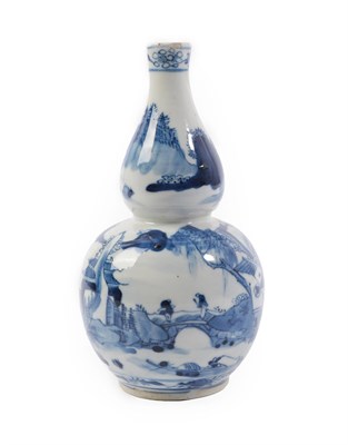 Lot 273 - A Chinese Porcelain Double Gourd Vase, Kangxi reign mark but circa 1900, painted in underglaze blue