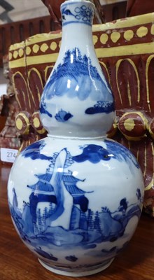 Lot 273 - A Chinese Porcelain Double Gourd Vase, Kangxi reign mark but circa 1900, painted in underglaze blue