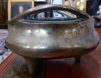 Lot 277 - A Chinese Bronze Censer, Xuande reign mark but not of the period, of circular form with loop...