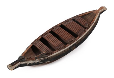 Lot 278 - A Late 19th/Early 20th Century African Model of a Wood-Hewn Boat, with panels of bound wooden...