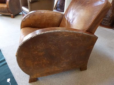 Lot 282 - A Pair of 1930's Rosewood Framed Club Armchairs, covered in vintage close-nailed brown leather,...