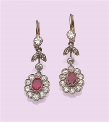 Lot 582 - A Pair of Ruby and Diamond Drop Earrings, two round brilliant cut diamonds spaced by a diamond...