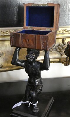 Lot 320 - A Carved and Painted Figural Business Card Holder, as a kneeling blackamoor holding a...