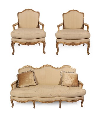 Lot 344 - A Late 19th Century French Giltwood Three Piece Salon Suite, recovered in striped silk cotton,...