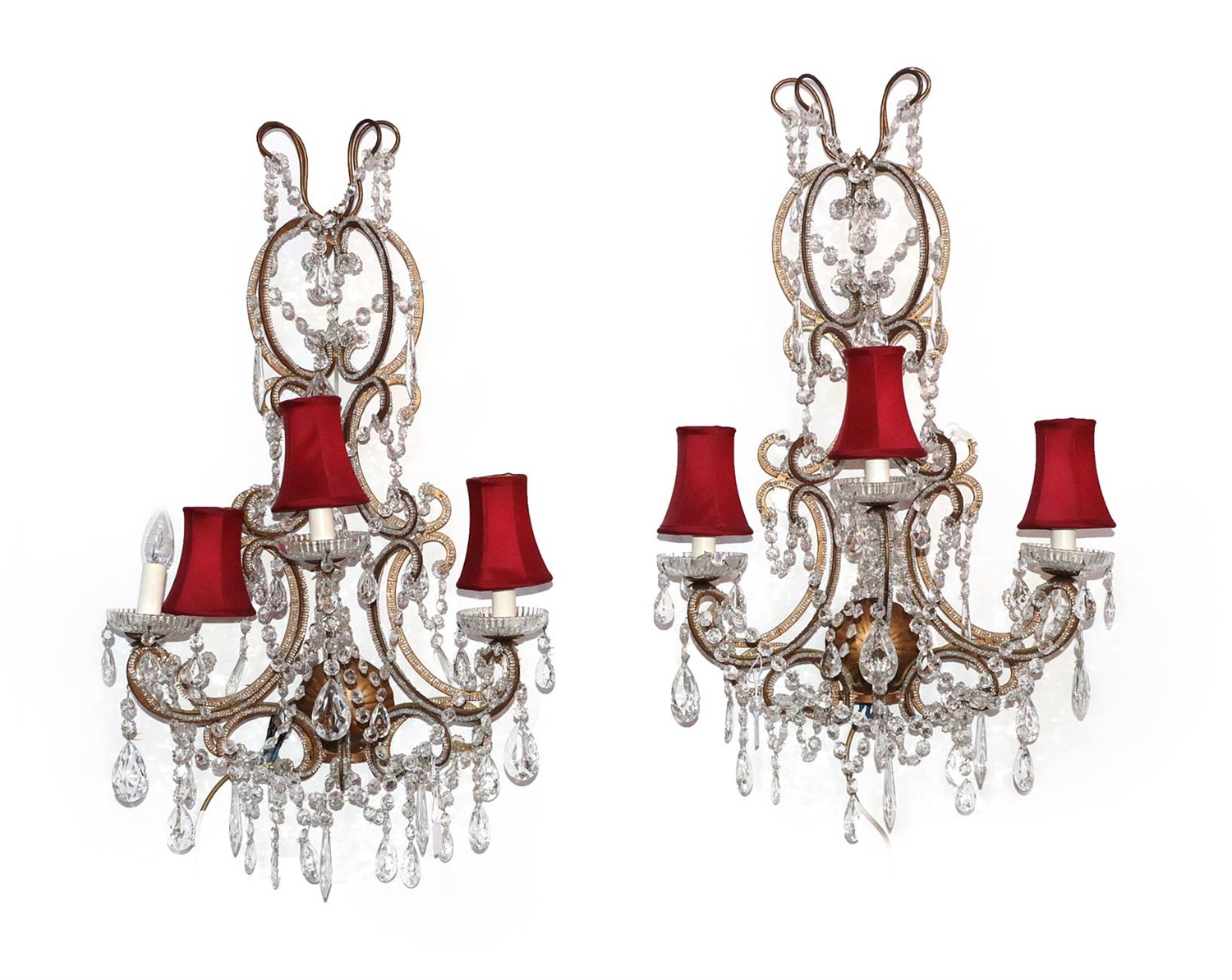 Lot 348 - A Pair of Gilt Metal and Cut Glass Three-Light Wall Lights, in 18th century style, with scroll...