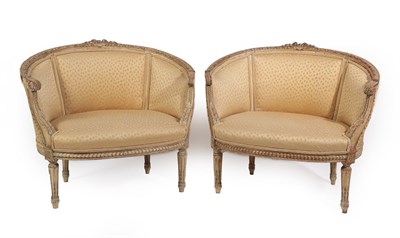 Lot 360 - A Pair of French Louis XVI Style Cream-Painted Marquis, late 19th century, each with foliate carved