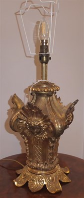 Lot 369 - A French Gilt Brass Table Lamp, in Louis XIV style, as an Ionic capital applied with masks...