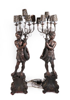 Lot 412 - A Pair of 20th Century Composition Blackamoor Figures, each modelled as a female holding a...