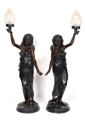 Lot 418 - A Pair of French Bronze Figural Torcheres, early 20th century, as classical maidens standing...