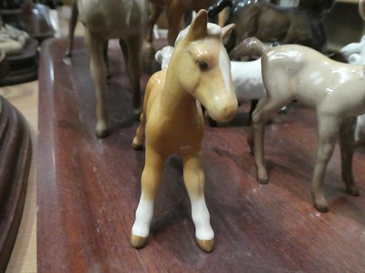 Lot 1 - Beswick horses, pigs and deer including New Forest Pony, Palomino Cob and two foals, together...