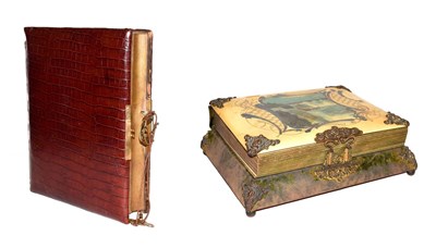 Lot 10 - An Edwardian musical photograph album (empty) mounted in crocodile skin, together with a...