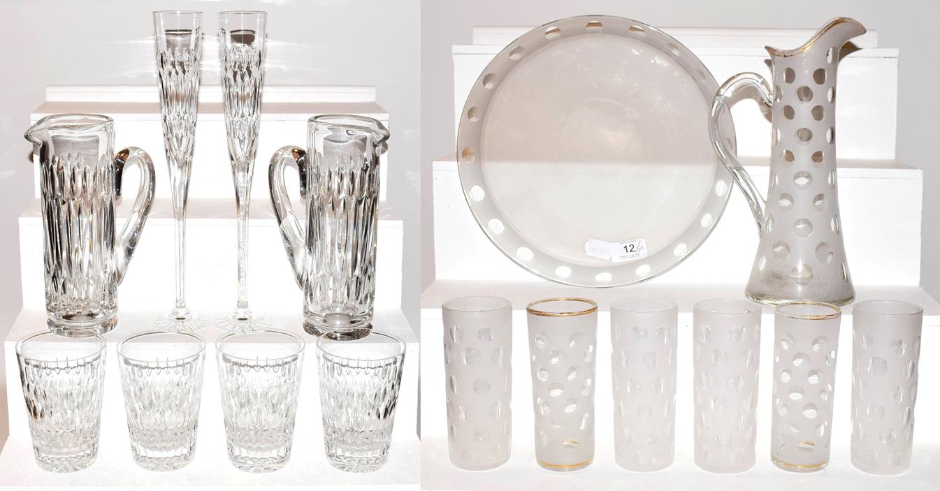 Lot 12 - An Asprey & Garrard part suite of glassware with acid etched marks, including two ewers, large pair
