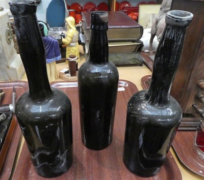 Lot 16 - A tray of 18th and 19th century glass bottles including a string neck mallet wine bottle, seal...
