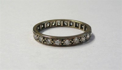 Lot 597 - A Diamond Full Eternity Ring, round brilliant cut diamonds in white claw settings to a flat...