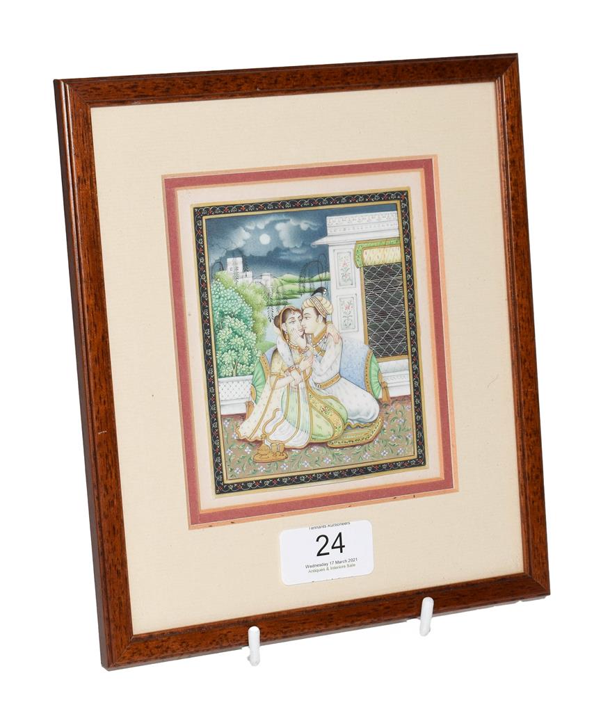 Lot 24 - A 19th century Indian Mughal miniature painting on ivory, courting scene under a moonlit sky, later