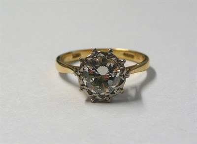 Lot 598 - A Diamond Solitaire Ring, the round brilliant cut diamond in a white illusion setting, to a tapered