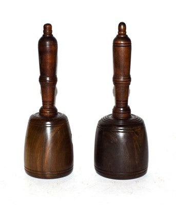 Lot 33 - Two lignum vitae stonemasons mallets with turned mahogany handles, longest 25cm (2)