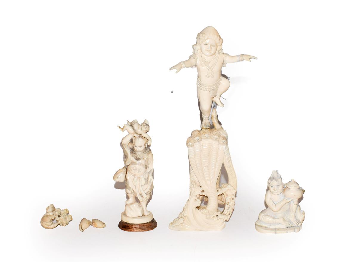 Lot 53 - A quantity of ivory items comprising, a 19th century Indian carved ivory figure of a Deity stood on